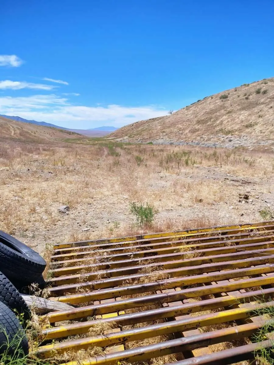Dun Glen canyon valley viewed over drill rods Nevada