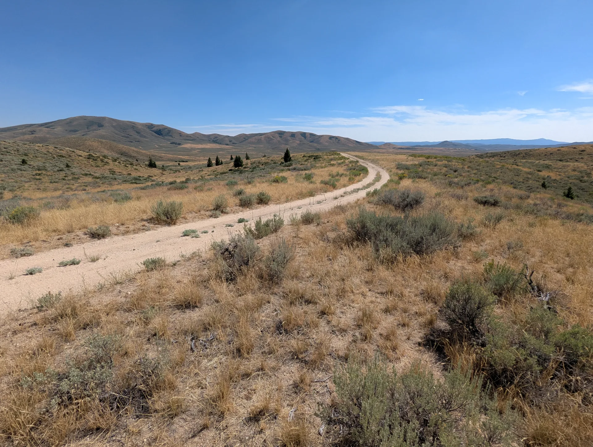 The road running directly to the project across the sage flats.